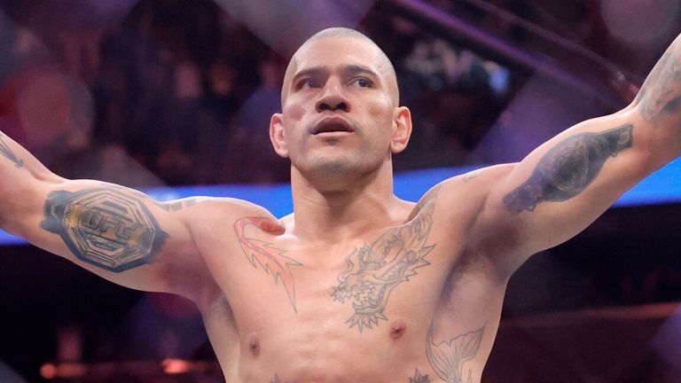 Alex Pereira celebrates after defeating UFC light heavyweight champion Magomed Ankalaev