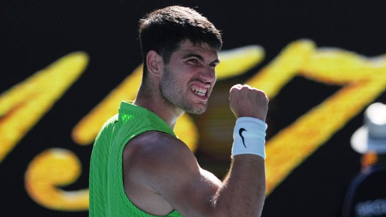 Carlos Alcaraz took the latest step in his bid for ‌the career Grand Slam with victory over a gutsy Yannick Hanfmann