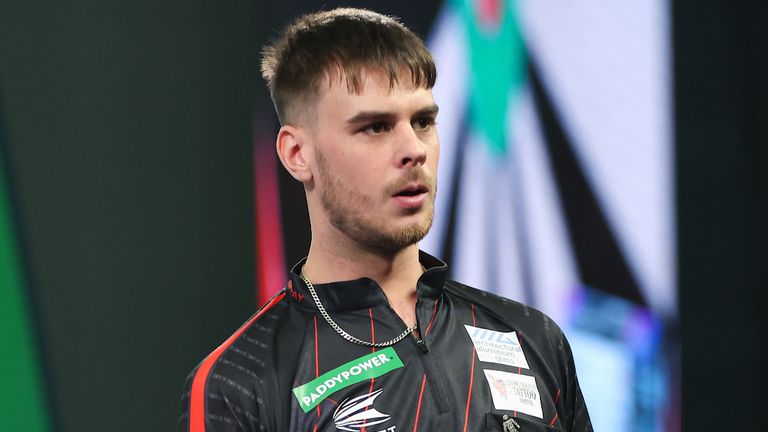 Dom Taylor, pictured during the first round of the World Darts Championship, has been banned for six months