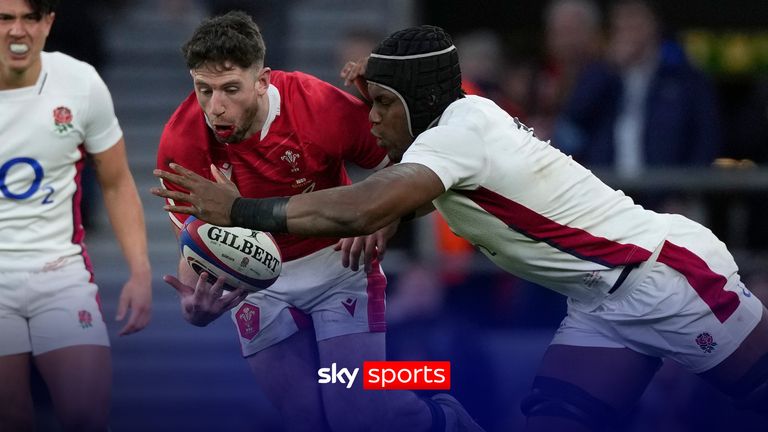 Wales' Alex Cathbert, left is tackled by England's Maro Itoje during the Six Nations rugby union match between England and Wales at Twickenham stadium, London, Saturday, Feb. 26, 2022. 