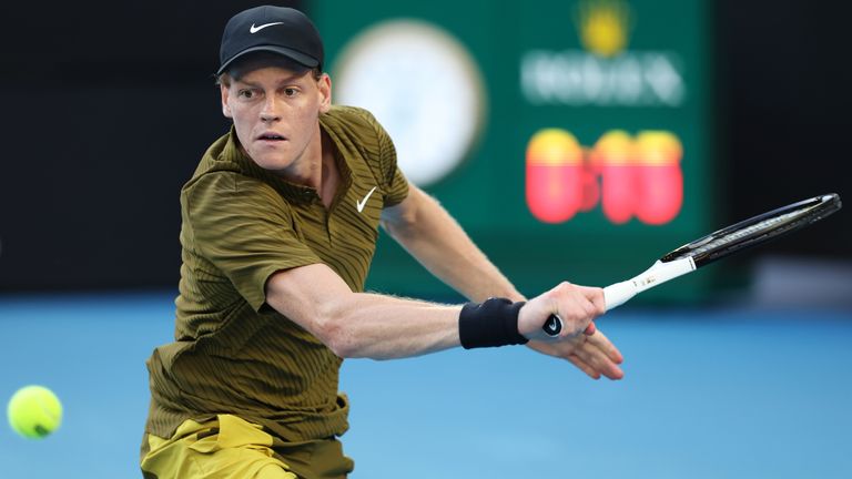 Jannik Sinner of Italy plays a backhand against Hugo Gaston of France in the Men's Singles First Round during day three of the 2026 Australi