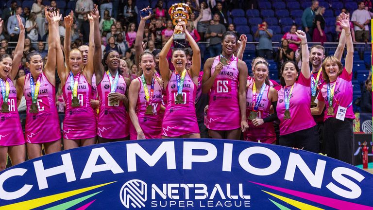 London Pulse players celebrate with the trophy after winning the Netball Super League Grand Final